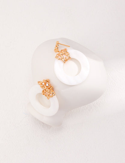 Boucles d’oreilles minimalistes en forme de coquillage